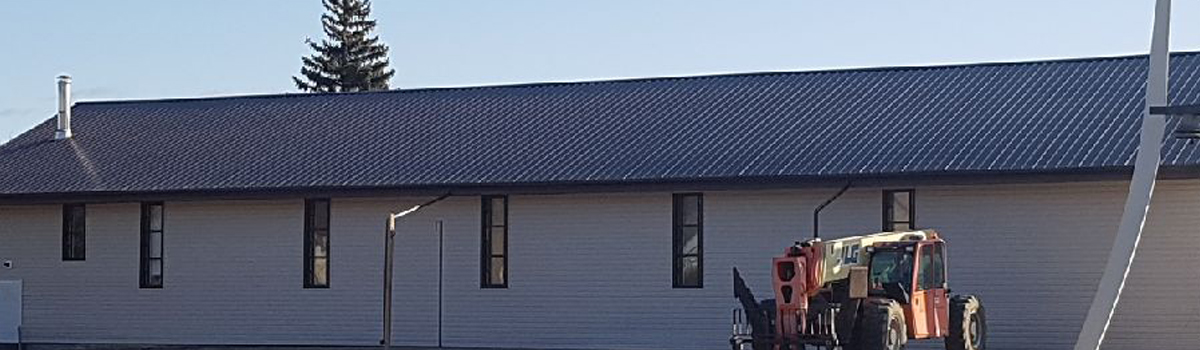 Madge Roofing Inc shingles house roof